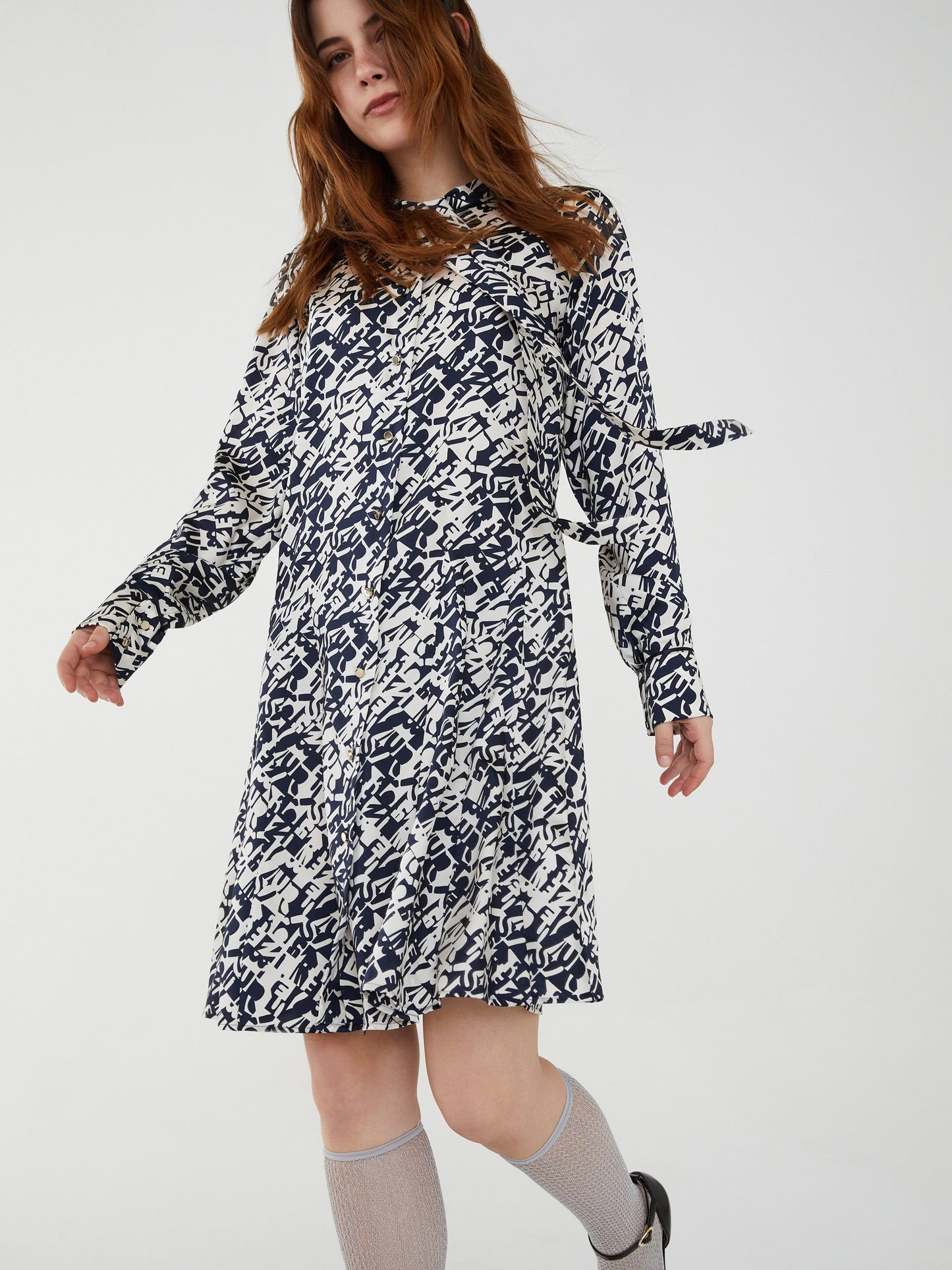 Belgio Navy Print Dress with Tie Adorned Band Collar